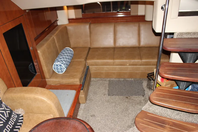 Slide: The Image of Interior of 2006 Sea Ray 40 Sundancer with leather seating and wooden stairs. - 44