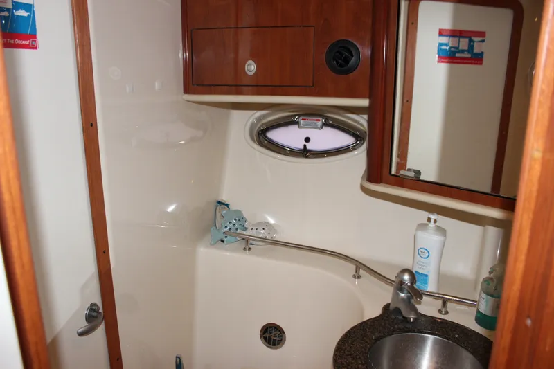 Slide: The Image of Bathroom interior of 2006 Sea Ray 40 Sundancer yacht with sink and mirror. - 38