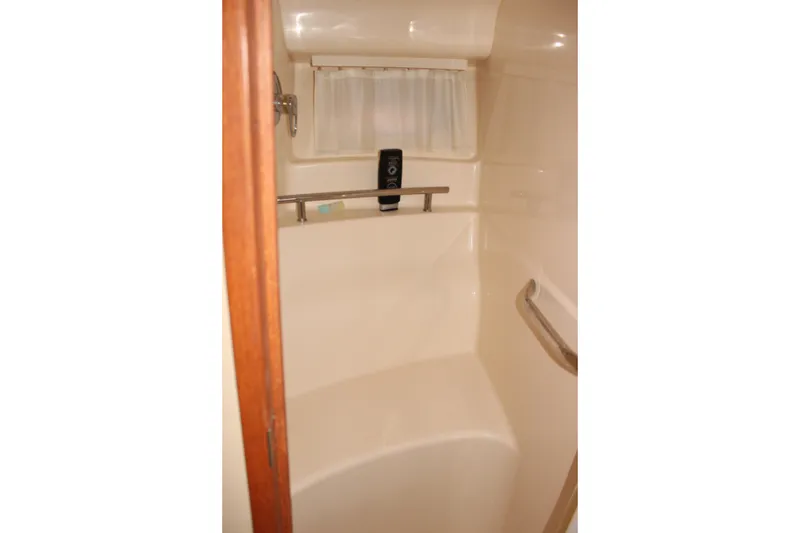 Slide: The Image of Bathroom interior of 2006 Sea Ray 40 Sundancer yacht with shower and curtain. - 41