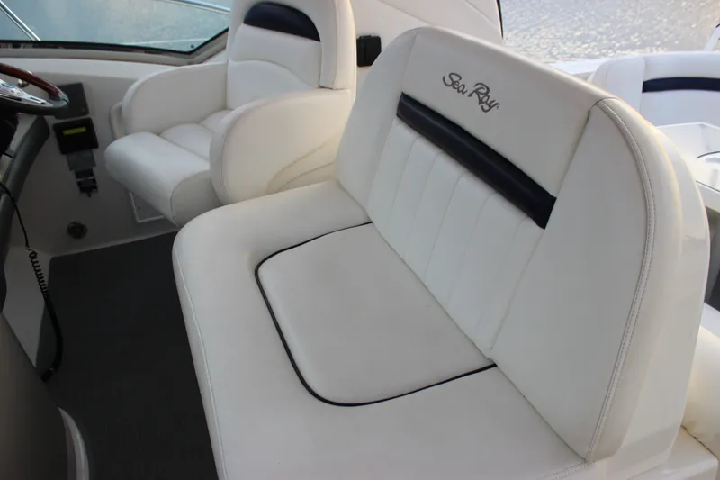 Slide: The Image of Interior seating of 2006 Sea Ray 40 Sundancer boat, featuring white leather upholstery. - 19