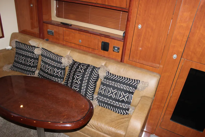 Slide: The Image of Luxurious interior of 2006 Sea Ray 40 Sundancer with plush seating and decorative pillows. - 25