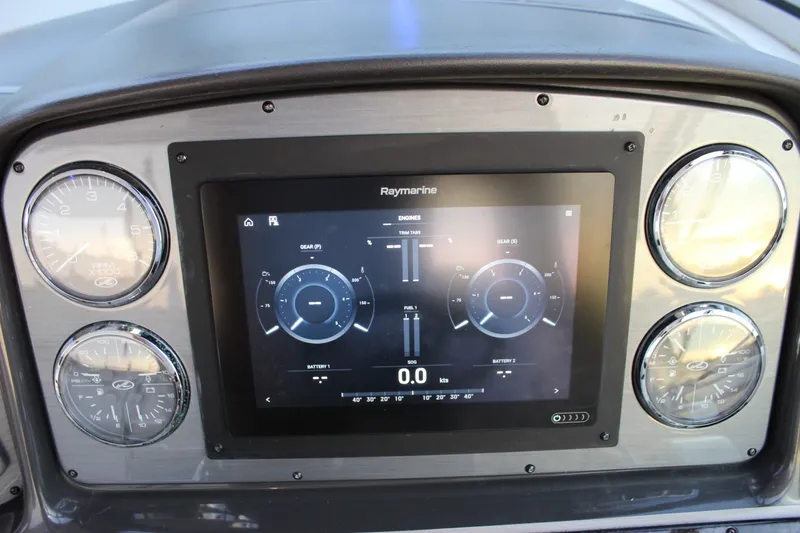 Slide: The Image of Dashboard of 2006 Sea Ray 40 Sundancer with Raymarine display and gauges. - 54