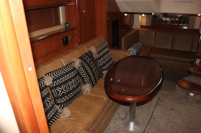 Slide: The Image of Luxurious interior of 2006 Sea Ray 40 Sundancer yacht with plush seating and elegant table. - 34