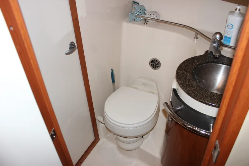Slide: The Image of Compact bathroom in 2006 Sea Ray 40 Sundancer yacht with toilet and sink. - 37