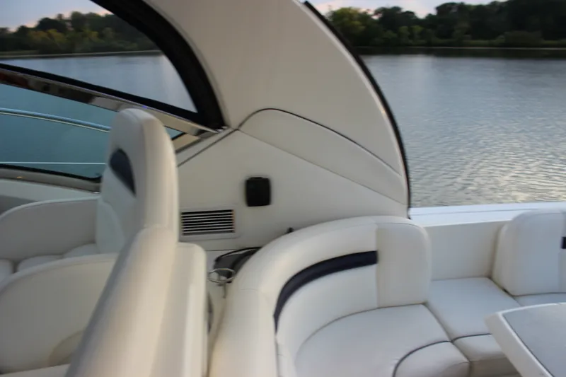 Slide: The Image of Interior of 2006 Sea Ray 40 Sundancer yacht with white seating and water view. - 14