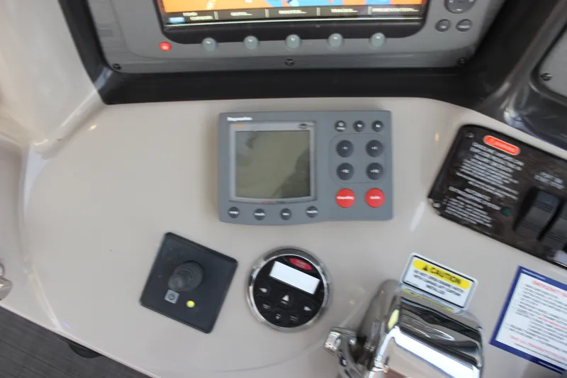 Slide: The Image of Control panel of a 2006 Sea Ray 40 Sundancer boat with navigation equipment. - 57