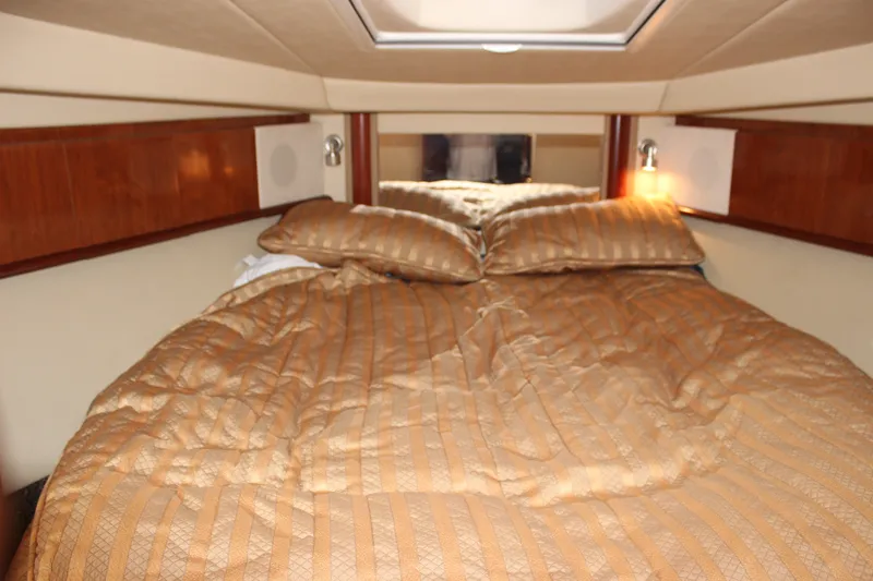 Slide: The Image of Luxurious cabin interior of 2006 Sea Ray 40 Sundancer yacht with cozy bedding. - 31