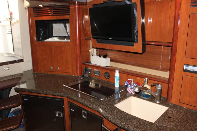 Slide: The Image of Luxurious 2006 Sea Ray 40 Sundancer yacht interior with modern kitchen amenities. - 36