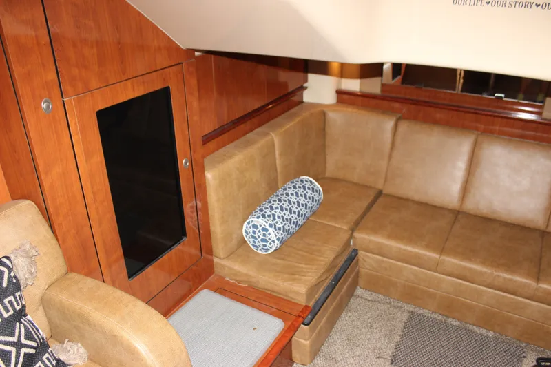 Slide: The Image of Luxurious interior of 2006 Sea Ray 40 Sundancer with leather seating and wooden accents. - 45
