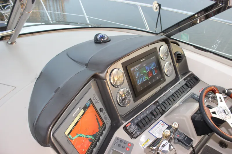 Slide: The Image of Control panel of a 2006 Sea Ray 40 Sundancer yacht with navigation equipment. - 20