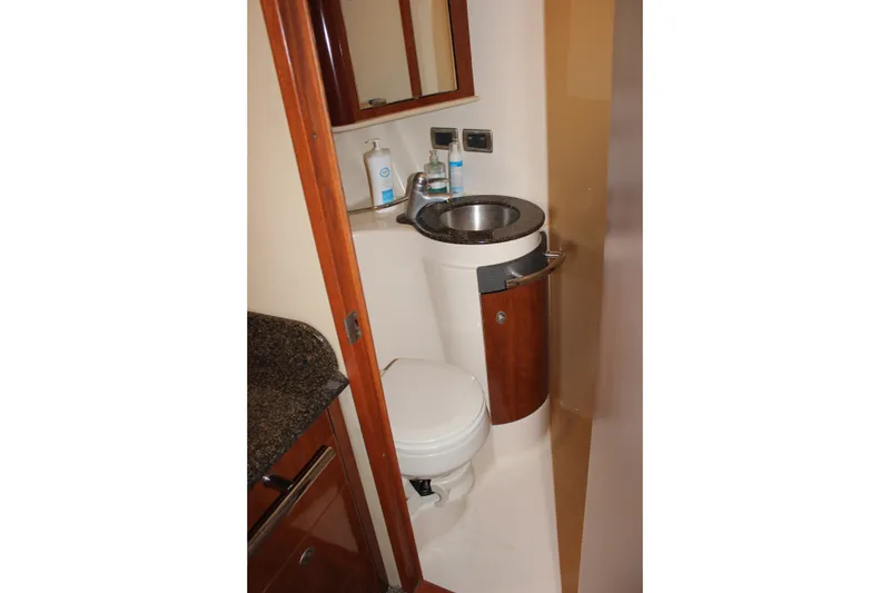 Slide: The Image of Compact bathroom in 2006 Sea Ray 40 Sundancer yacht with sink and toilet. - 42