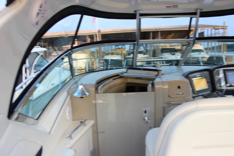 Slide: The Image of Interior view of 2006 Sea Ray 40 Sundancer yacht cockpit with navigation equipment. - 12