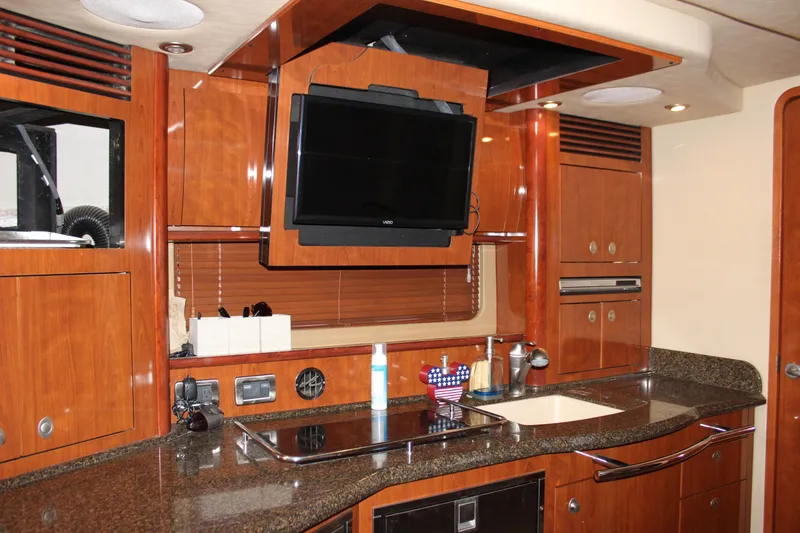 Slide: The Image of Luxurious 2006 Sea Ray 40 Sundancer yacht interior with modern kitchen and TV. - 27