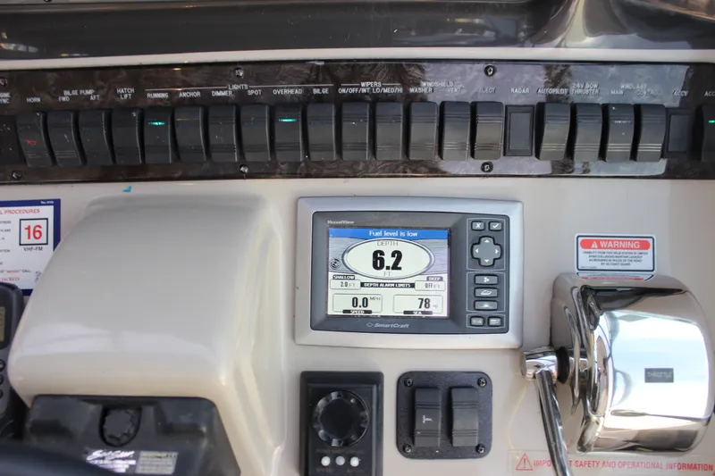 Slide: The Image of Control panel of a 2006 Sea Ray 40 Sundancer boat with depth gauge and switches. - 51