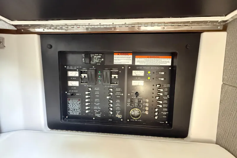Slide: The Image of Electrical control panel on a 2021 Cruisers Yachts 38 GLS OB boat. - 58