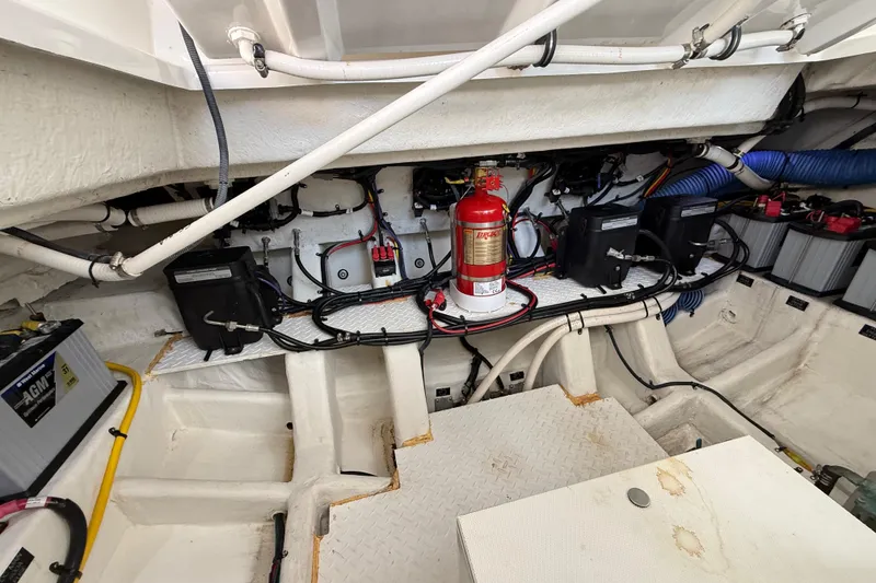 Slide: The Image of Engine compartment of 2021 Cruisers Yachts 38 GLS OB with fire extinguisher and wiring. - 66