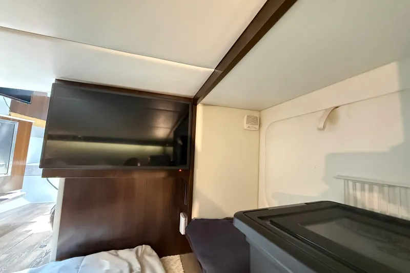 Slide: The Image of Interior cabin of 2021 Cruisers Yachts 38 GLS OB with TV and storage. - 53