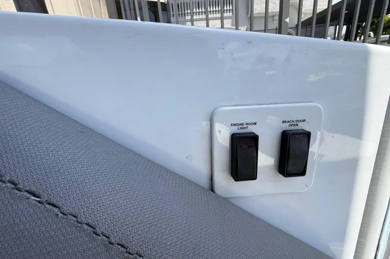 Slide: The Image of Control panel on 2021 Cruisers Yachts 38 GLS OB with switches for engine room light and beach door. - 25