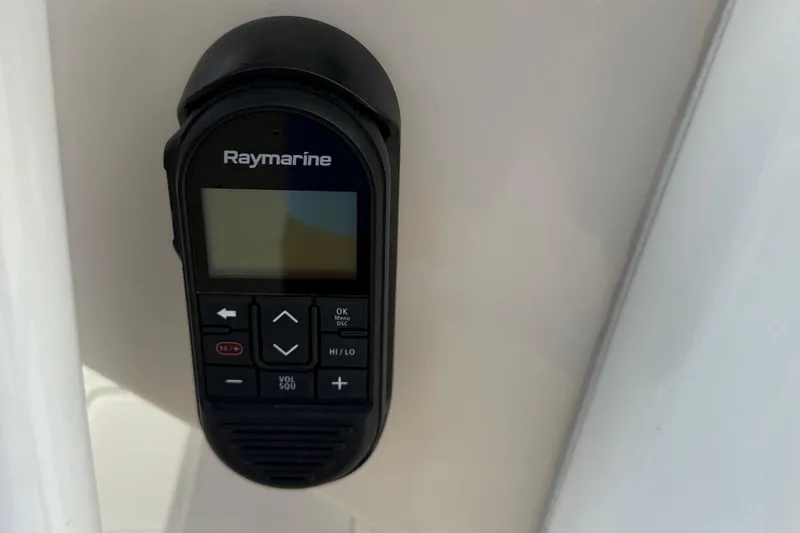 Slide: The Image of Raymarine control panel on 2020 Boston Whaler 330 Outrage boat dashboard. - 18