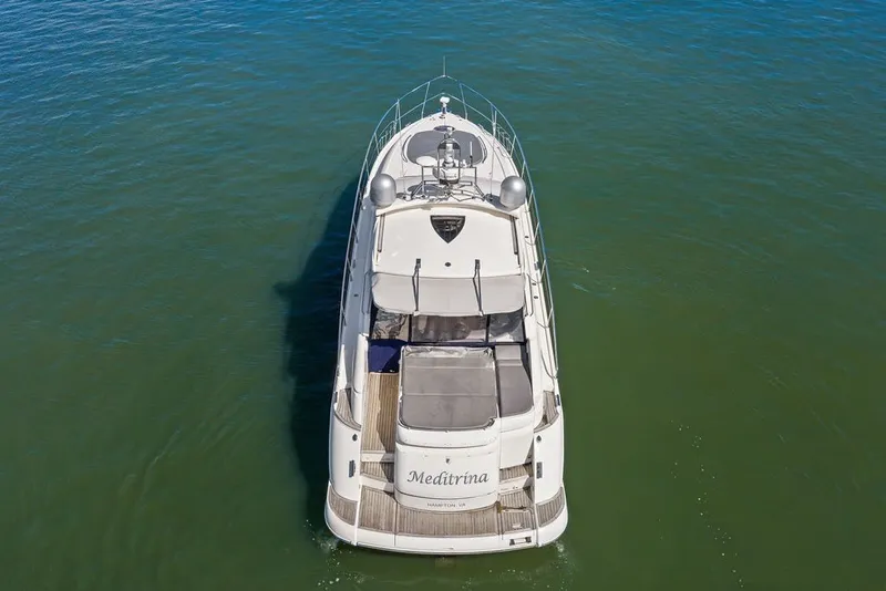 Slide: The Image of 2006 Fairline Targa 47 GT yacht on calm water, aerial view. - 9