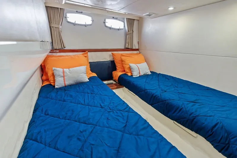 Slide: The Image of Twin beds with blue bedding in 2006 Fairline Targa 47 GT yacht cabin. - 56