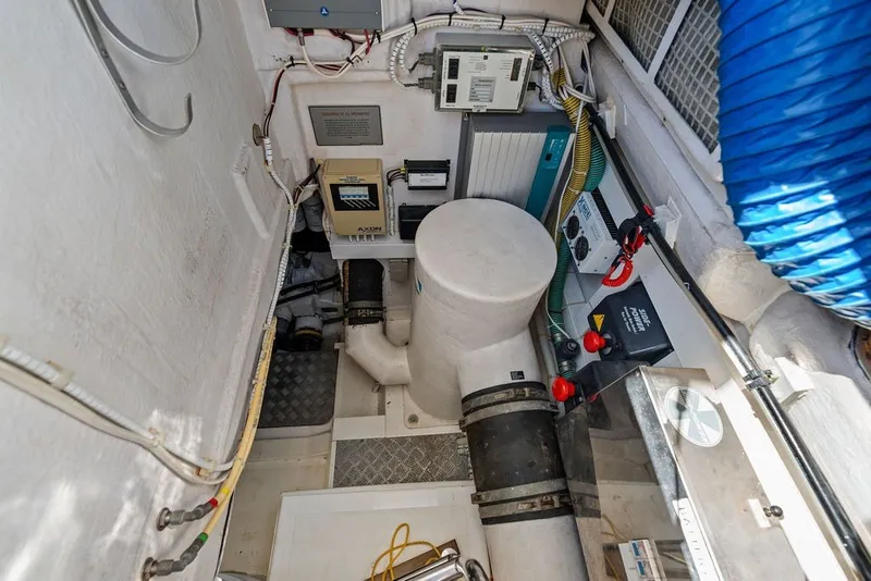 Slide: The Image of Engine room of 2006 Fairline Targa 47 GT yacht, showcasing mechanical components and wiring. - 63
