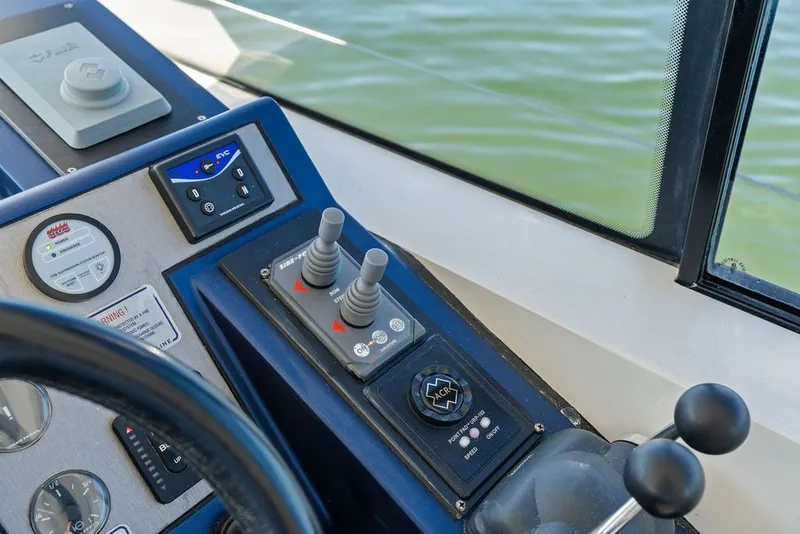 Slide: The Image of Control panel of a 2006 Fairline Targa 47 GT yacht with joysticks and gauges. - 42