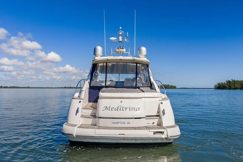 Slide: The Image of 2006 Fairline Targa 47 GT yacht on calm water under blue sky. - 8