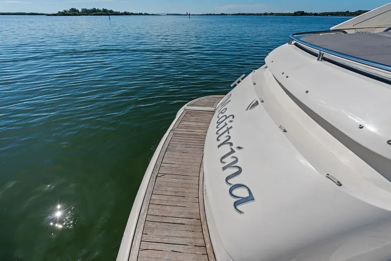 Slide: The Image of 2006 Fairline Targa 47 GT yacht on calm water, rear view. - 24