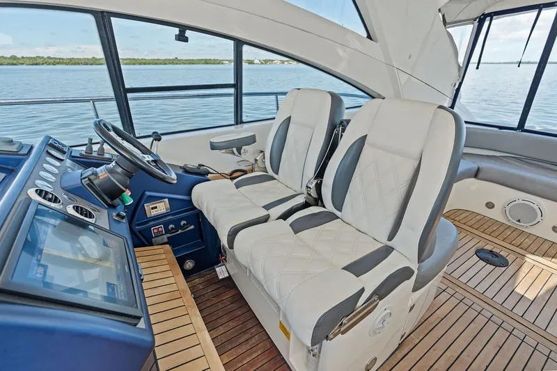 Slide: The Image of Interior of 2006 Fairline Targa 47 GT yacht with luxurious seating and navigation controls. - 40