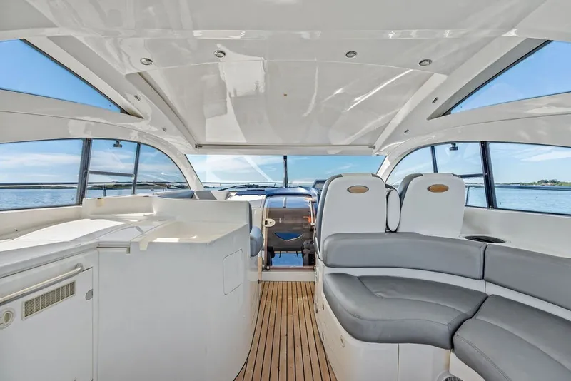 Slide: The Image of Interior of 2006 Fairline Targa 47 GT yacht with sleek seating and panoramic windows. - 38