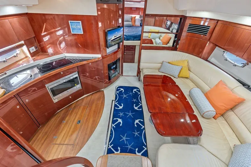 Slide: The Image of Luxurious interior of 2006 Fairline Targa 47 GT yacht with modern kitchen and cozy seating area. - 45