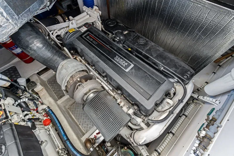 Slide: The Image of Engine compartment of a 2006 Fairline Targa 47 GT yacht, showcasing detailed machinery. - 61