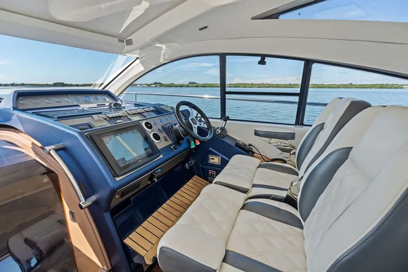 Slide: The Image of Interior of 2006 Fairline Targa 47 GT yacht with modern dashboard and seating. - 39