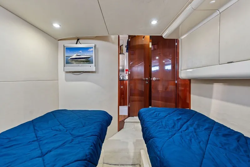 Slide: The Image of Interior cabin of 2006 Fairline Targa 47 GT yacht with twin beds and TV. - 57