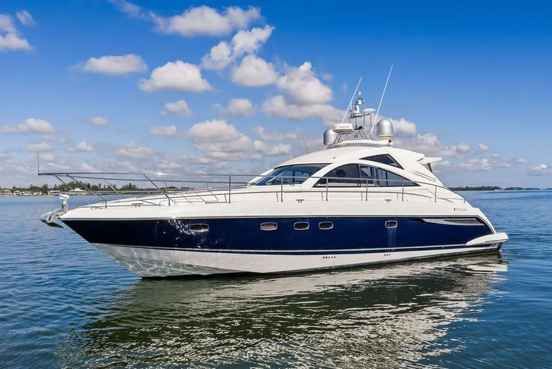The Image of 2006 Fairline Targa 47 GT yacht on calm water under blue sky. - 0