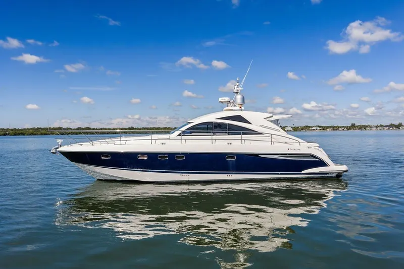 Slide: The Image of 2006 Fairline Targa 47 GT yacht on calm water under blue sky. - 2