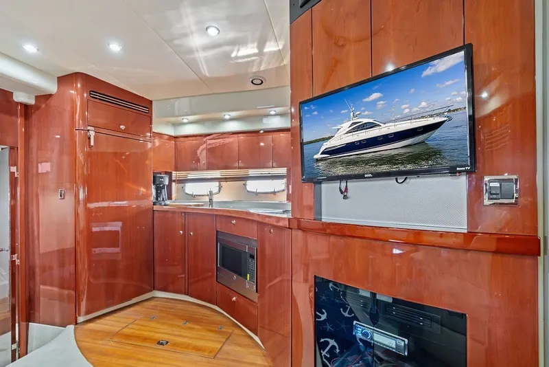 Slide: The Image of Luxurious interior of 2006 Fairline Targa 47 GT yacht with wood finish and modern amenities. - 48