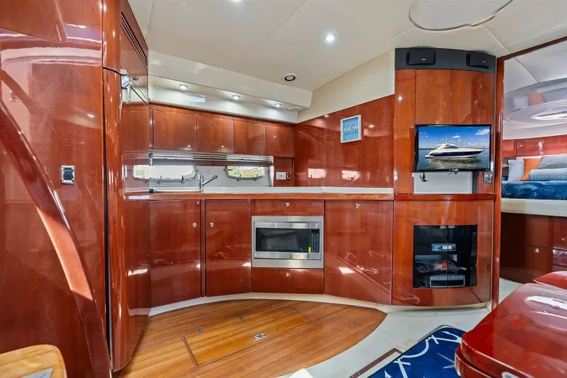 Slide: The Image of Luxurious interior of 2006 Fairline Targa 47 GT yacht with wood finish and modern amenities. - 49