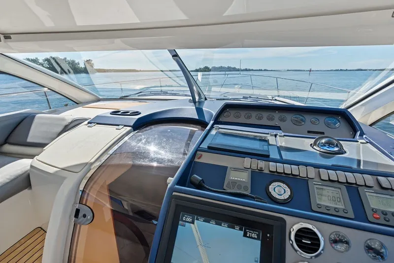 Slide: The Image of Interior view of 2006 Fairline Targa 47 GT yacht cockpit with navigation controls. - 44