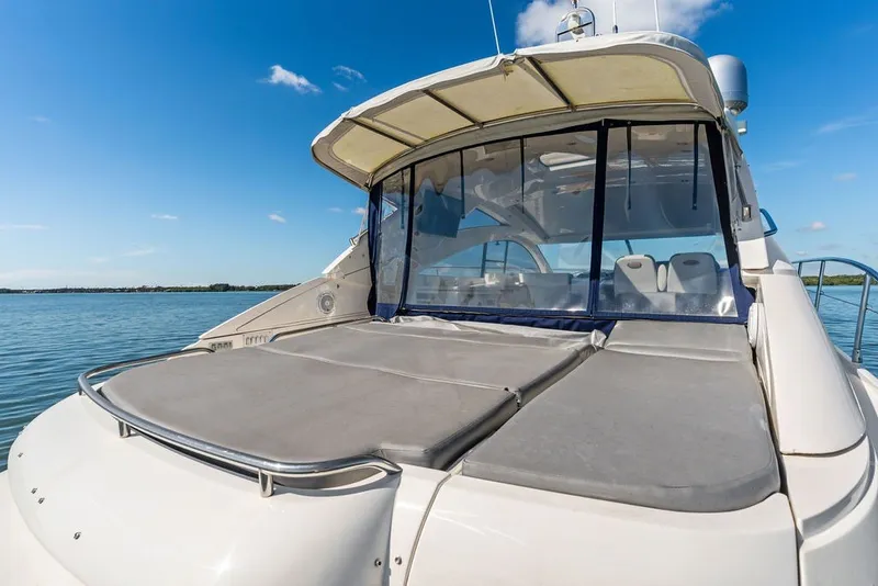 Slide: The Image of 2006 Fairline Targa 47 GT yacht with sun deck, clear skies, and calm waters. - 29