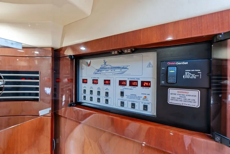 Slide: The Image of Control panel inside 2006 Fairline Targa 47 GT yacht, featuring Onan GenSet system. - 51