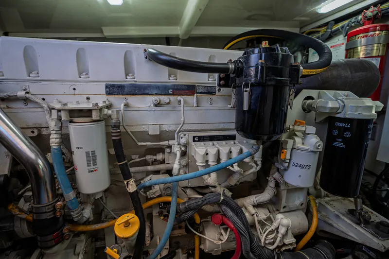 Slide: The Image of Engine room of the 2006 Tiara Yachts 4400 Sovran with complex hoses and filters. - 47