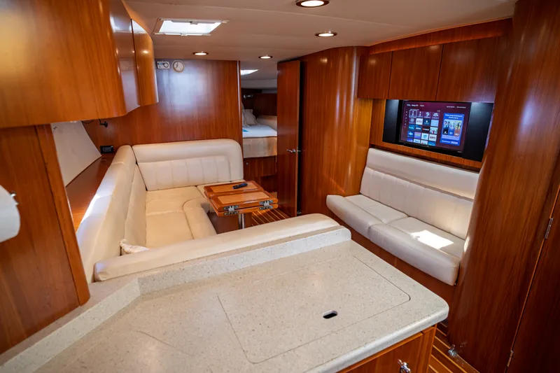 Slide: The Image of Interior of a 2006 Tiara Yachts 4400 Sovran with elegant wood paneling and comfortable seating. - 37