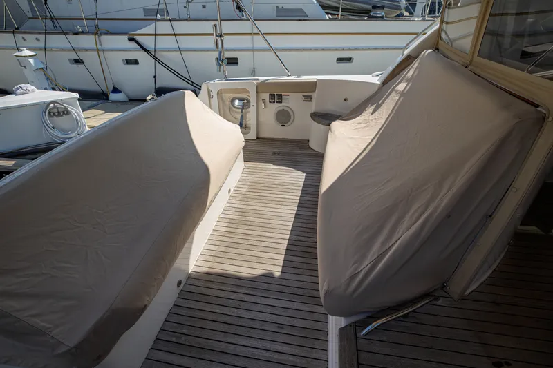 Slide: The Image of The image shows the aft deck of a 2006 Tiara Yachts 4400 Sovran with covers. - 26
