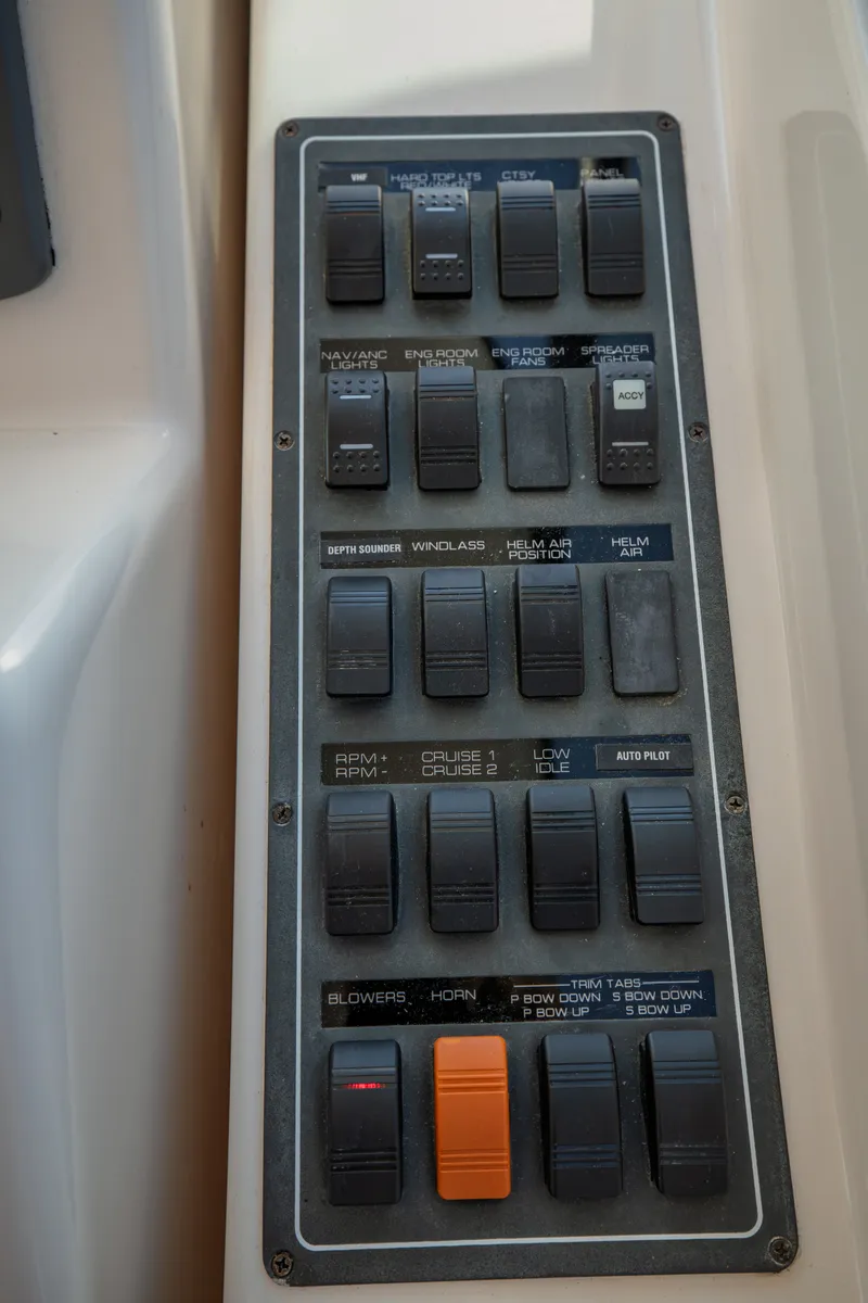 Slide: The Image of Control panel with various switches and buttons on a 2006 Tiara Yachts 4400 Sovran. - 20
