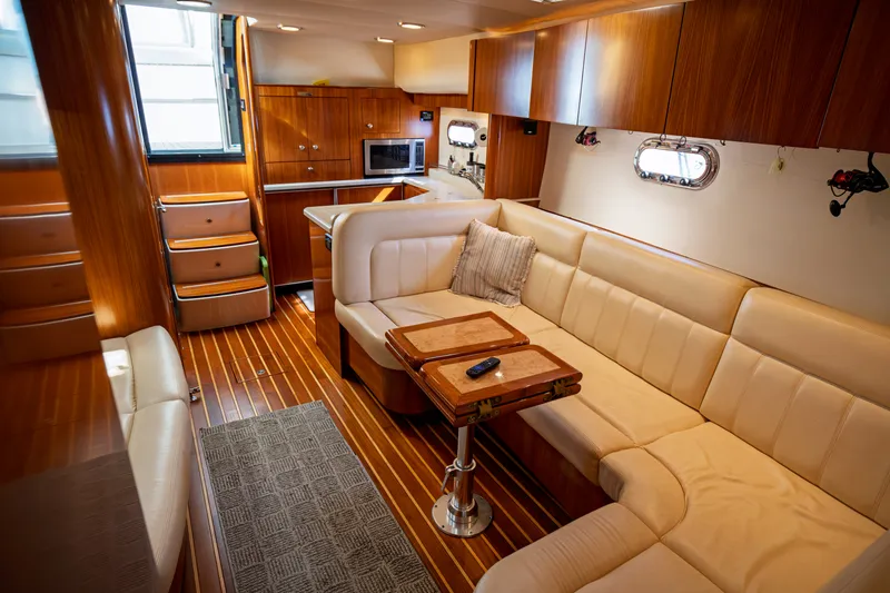 Slide: The Image of Interior of the 2006 Tiara Yachts 4400 Sovran with elegant leather seating and wooden furnishings. - 38