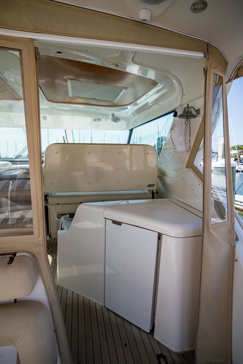 Slide: The Image of Interior of a 2006 Tiara Yachts 4400 Sovran with sleek white furnishings. - 24
