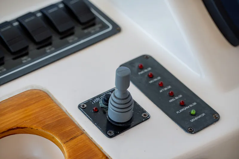 Slide: The Image of Close-up of a joystick and control lights on a boat. - 18