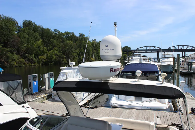Slide: The Image of 2007 Cruisers Yachts 340 Express docked at marina with other boats. - 28